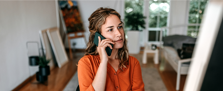 Image of woman on phone contacting Locke Funeral Services to discuss funeral planning